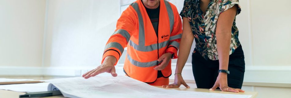 Engineers Looking at Blueprint